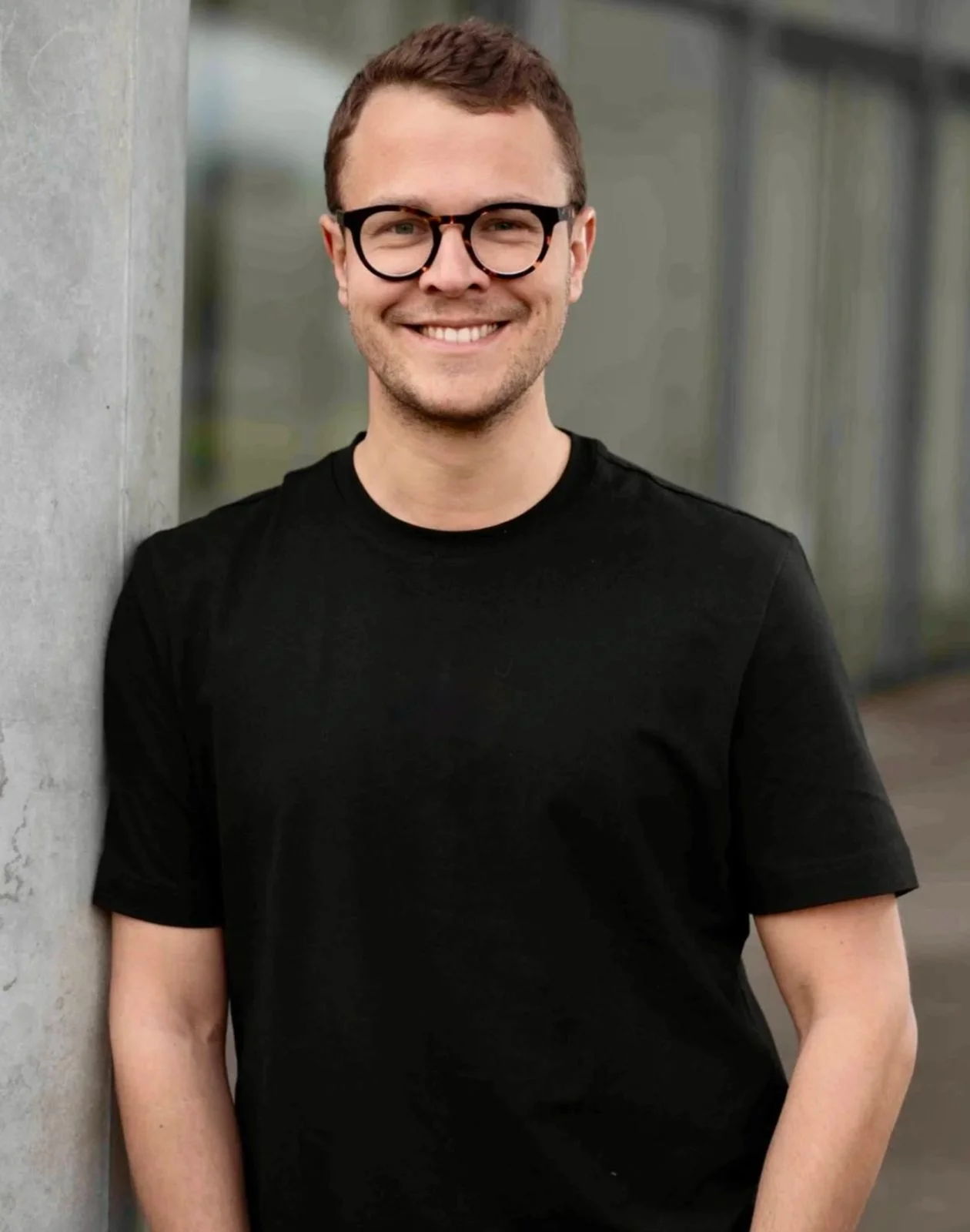 Porträtfoto von Julian Merkel, Kunde von Studio Interrobang (The Scaling Company München)